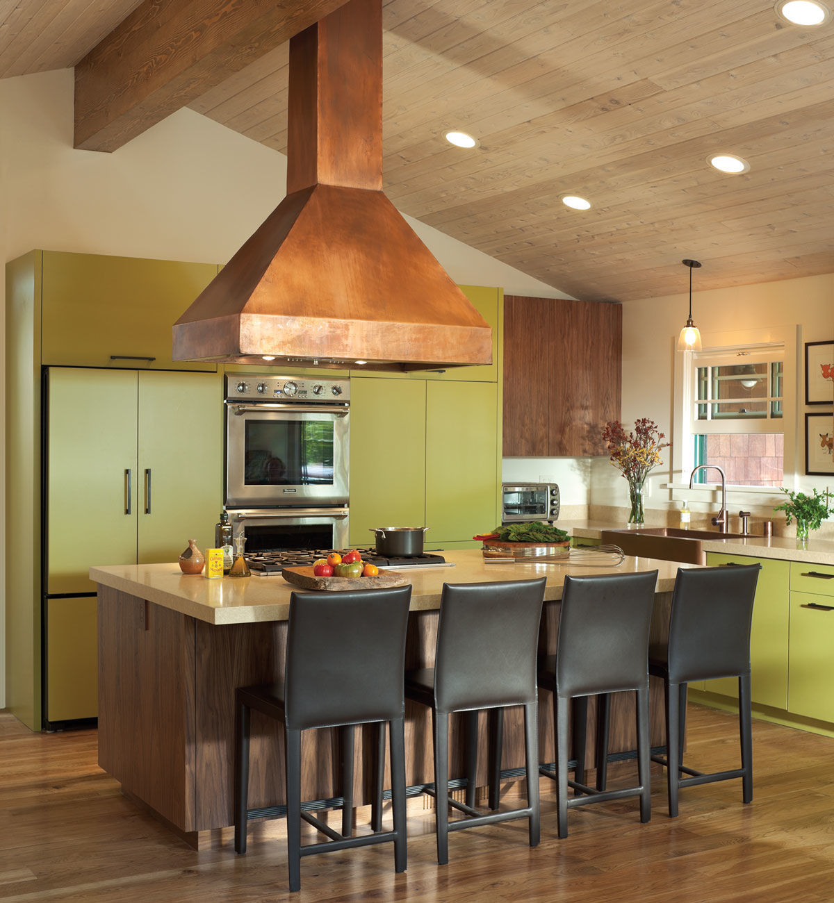 view of the kitchen island with bar seating
